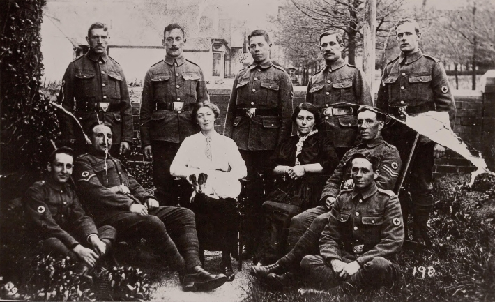 Nine men of the Unit with their landladies in Prestatyn 1915