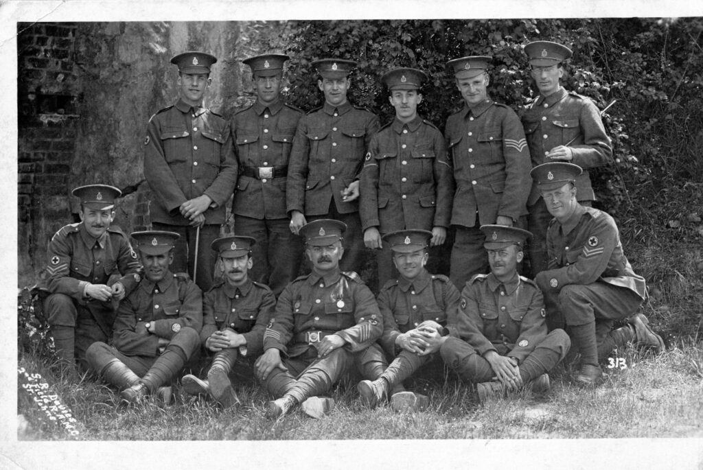 48192 Cpl Ernest Sweeting crouching on far left